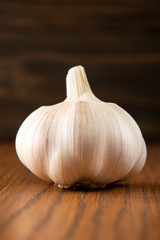 Garlic bulb on the wooden vintage background