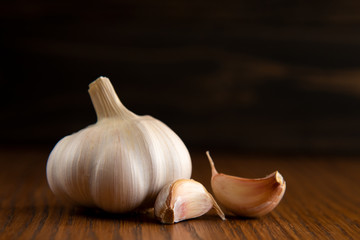 Garlic bulb on the wooden vintage background