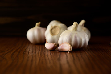 Garlic bulb on the wooden vintage background