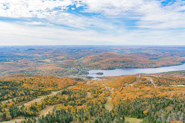 Fototapeta na wymiar Aerial view of Mont-Tremblant National Park with Lake Tremblant in fall color