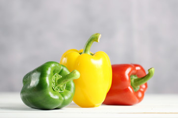 Sweet pepper on white wooden table.