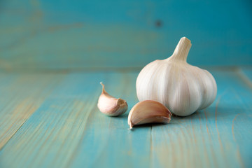 Garlic bulb on the wooden vintage background