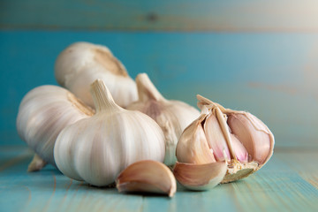 Garlic bulb on the wooden vintage background