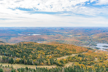 Fototapeta na wymiar Aerial view of Mont-Tremblant National Park with Lake Tremblant in fall color