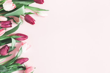 Flowers composition. Tulip flowers on pastel pink background. Valentines day, mothers day, womens day, spring, easter concept. Flat lay, top view, copy space