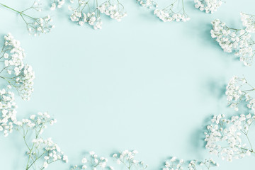Flowers composition. Gypsophila flowers on pastel blue background. Flat lay, top view, copy space