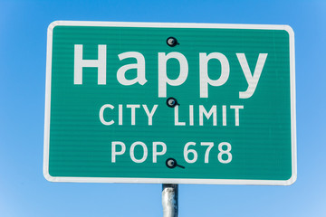 Happy city limit road sign in Texas.