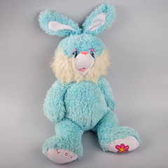 Little blue bunny on a gray background.