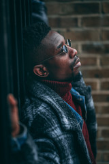 Young fashionable man posing for stylish urban photo shoot 