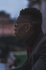 Young fashionable man posing for stylish urban photo shoot 