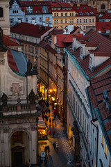 View on the roofs and street in Stare Misto. Prague. Sunset