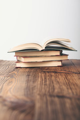 A few old books on wooden table in antique bookstore