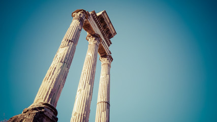 Three columns of the Temple of Castor and Pollux at the Roman Forum in Rome, Italy