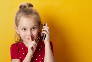 little girl 5 years old talking on a cell phone , place for text