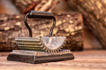 Close up shot of a Antique Vintage 1866 Cast Iron Fluter, retro concept.