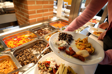 self service restaurant with many raw and cooked foods