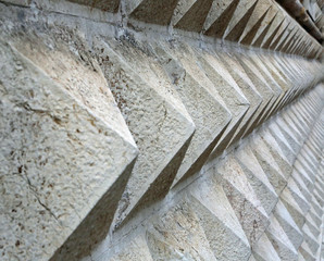 stones in the shape of a triangle of the building called Palazzo