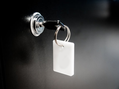 Black Row of metal lockers with locks, keys and numbered red tags in a sports changing room for securing personal effects during training, Mockup, Mock-up. A safe place to store the equipment. 