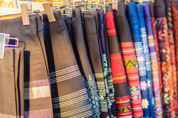 Beautiful Thai tribal clothes and tribal textile style in the northern of thailand. Beautiful handmade tribal cloth ethnic patterns for sale in the local market.