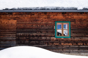 Wall, facade of old wooden house, hut with small window