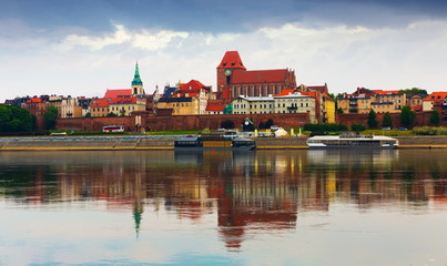 Fototapeta premium Torun with Cathedral Basilica across Vistula
