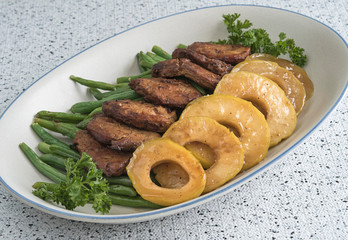 Meat Medallions with Beans and Apples on Platter