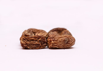 Shot of dry dates with white background in a studio