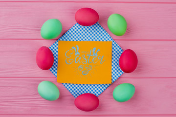 Happy Easter card and eggs. Frame from dyed vintage eggs and vintage napkin. Easter greeting ideas.