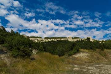 Fototapeta na wymiar Mountain landscape with blue sky and clouds