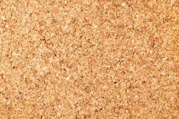 Empty copy space cork board texture. Brown natural corkboard backdrop for graphic design.