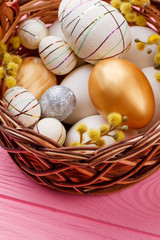Close up Easter decorated eggs in basket. Ideas of eggs decoration.