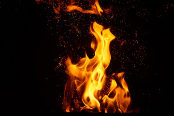 Fire flames and sparks on black background