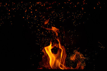 Fire flames and sparks on black background