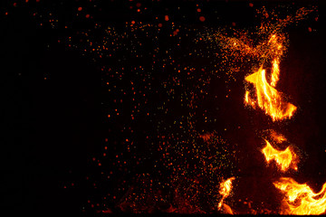 Fire flames and sparks on black background