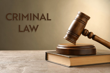 Wooden gavel and book on table. Law concept