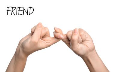 Woman showing word Friend on white background, closeup. Sign language