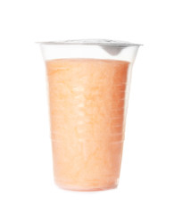 Yummy cotton candy in plastic cup on white background