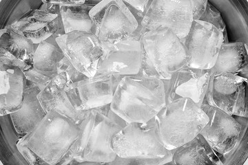 Bucket with ice cubes as background, closeup