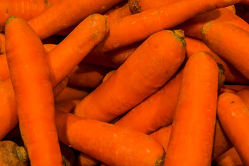 Background or texture from a lot of the washed bright carrots. Vitamins and vegetables. Healthy lifestyle. Basis for juice. Orange