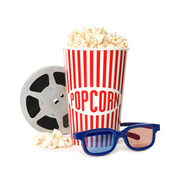 Popcorn, reel and glasses isolated on white. Cinema snack