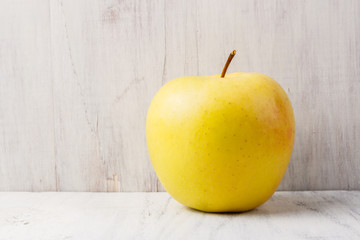 apple on white wooden table