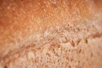 freshly baked bread on dark wooden kitchen table. Selective focus