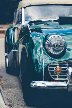 Headlights of a green vintage car