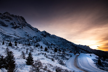 A beautiful sunset over the Tonale Pass and the mountains around it, during a winter sunny day. Tonale is a mountain pass between Lombardy and Trentino, near the Presena glacier