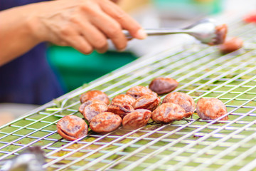Cooking for Kanom Ba Bin, Thai dessert Coconut Macaroon, is a traditional Thai dessert. Made from sticky rice powder, coconut cream, coconut, sugar, salt and coconut oil