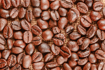 Coffee beans background. Roasted coffee beans close up
