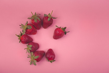 strawberry teamwork on pink background
