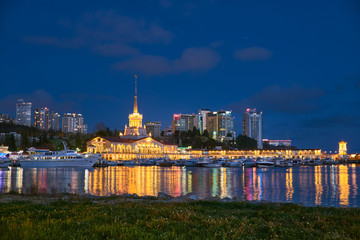 Obraz premium Yachts and boats anchored in the port of Sochi at sunset. Russia.
