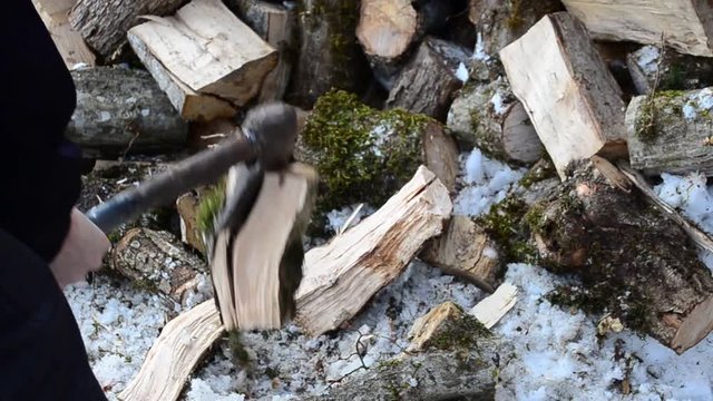 Man breaks wood for the winter