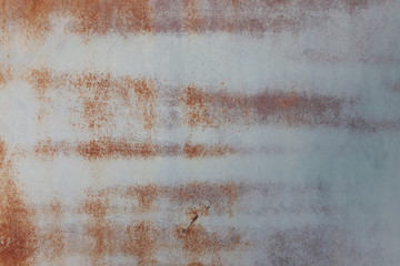 Rusty metal wall,old sheet of iron covered with rust background